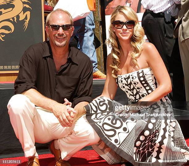 Kevin Costner and wife, Christine Baumgartner during Kevin Costner Honored with a Hand and Footprints Ceremony at Grauman's Chinese Theatre at...