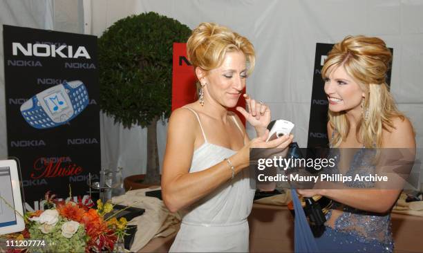 Edie Falco makes a call on a Nokia digital camera cell phone