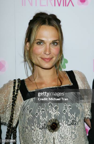 Actress Molly Sims arrives at the Intermix Boutique store opening at the Intermix Boutique store on September 25, 2007 in West Hollywood, California.