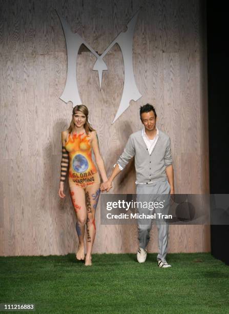 Clothing designer Eric Kim and a model walks the runway at the Monarchy Collection Spring 2008 fashion show at Smashbox Studios on October 18, 2007...