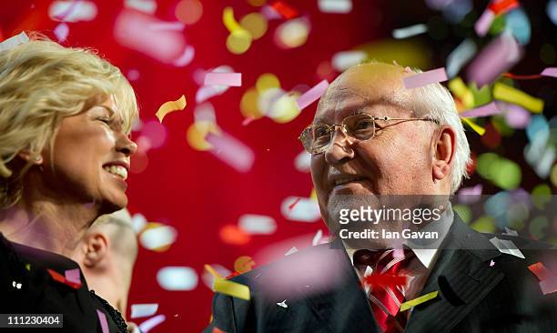Irina Virganskaya and Mikhail Gorbachev appear on stage during the finale of the Gorby 80 Gala at the Royal Albert Hall on March 30, 2011 in London,...