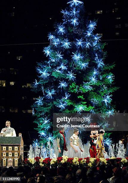 Sam Champion and Mickey Mouse along with several local New York School Children light the Lincoln Center Christmas Tree