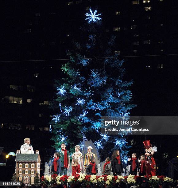 Sam Champion and Mickey Mouse along with several local New York School Children light the Lincoln Center Christmas Tree