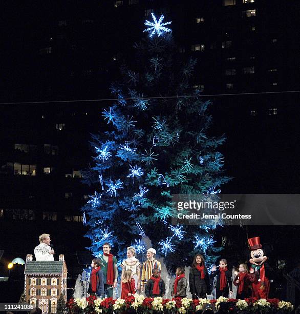 Sam Champion and Mickey Mouse along with several local New York School Children light the Lincoln Center Christmas Tree