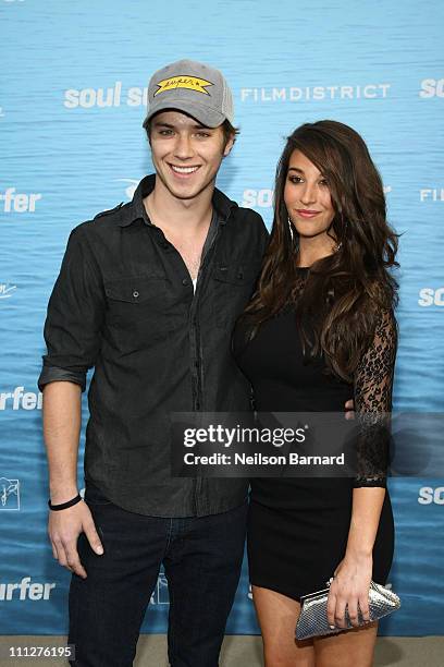Actor Jeremy Sumpter and Genevieve Helm attend the premiere of TriStar Pictures' "Soul Surfer" at the Arclight Cinerama Dome on March 30, 2011 in...