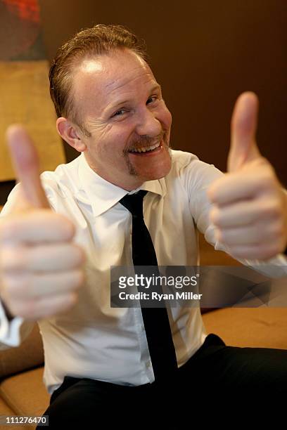Director Morgan Spurlock poses during CinemaCon, the official convention of the National Association of Theatre Owners, at The Colosseum of Caesars...