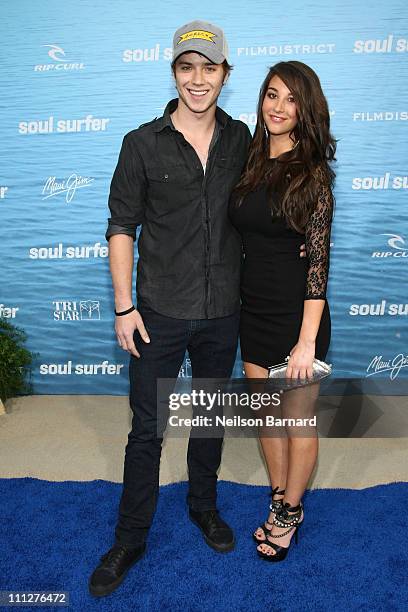 Actor Jeremy Sumpter and Genevieve Helm attend the premiere of TriStar Pictures' "Soul Surfer" at the Arclight Cinerama Dome on March 30, 2011 in...