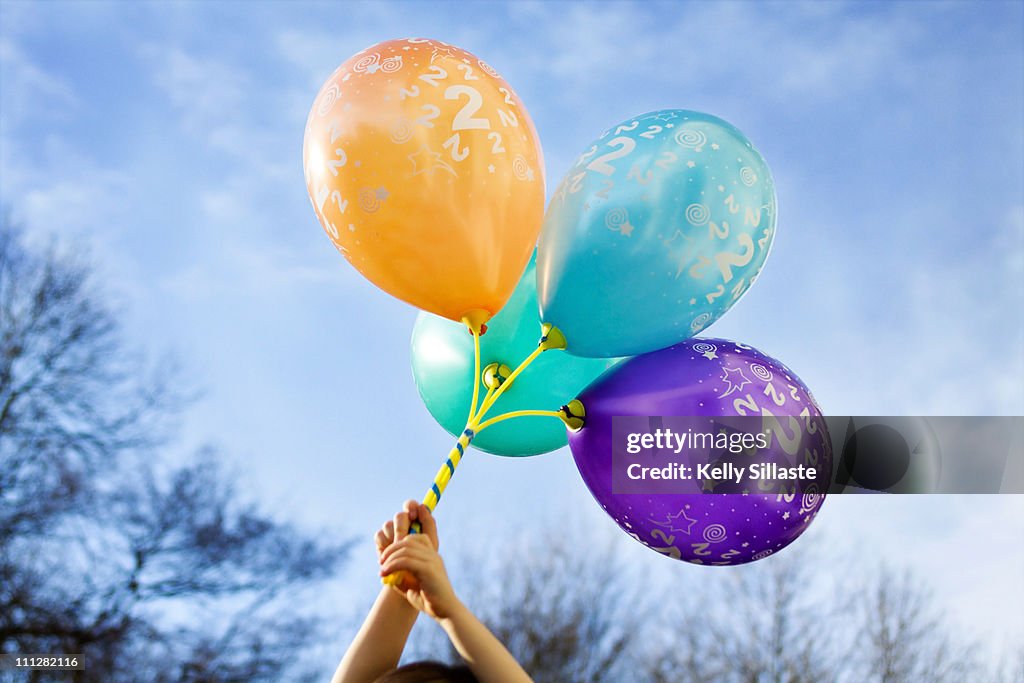 Bouquet of four colorful birthday balloons