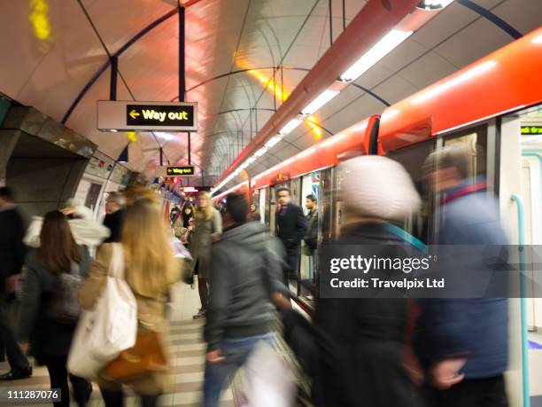 commuters on underground train, london - crowded subway stock pictures, royalty-free photos & images
