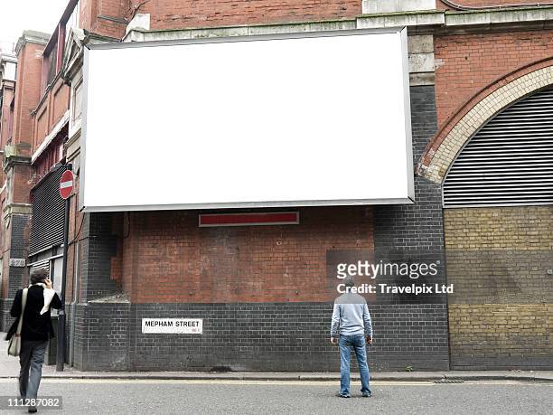 blank advertising billboard, london, uk - pedestrians stock-fotos und bilder