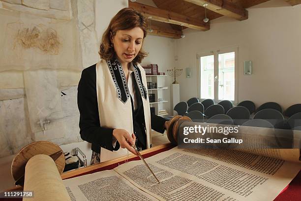 Rabbi Alina Treiger sings as she reads from a torah scroll in the small synagogue on March 31, 2011 in Oldenburg, Germany. Treiger is Germany's first...