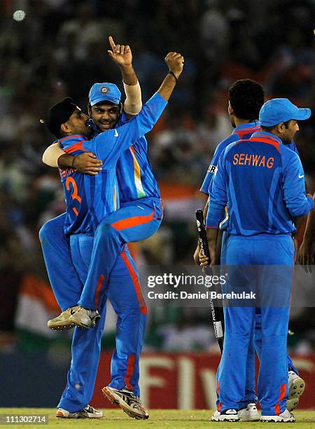 The Indian team celebrate victory over Pakistan during the 2011 ICC World Cup second Semi-Final between India and Pakistan at Punjab Cricket...