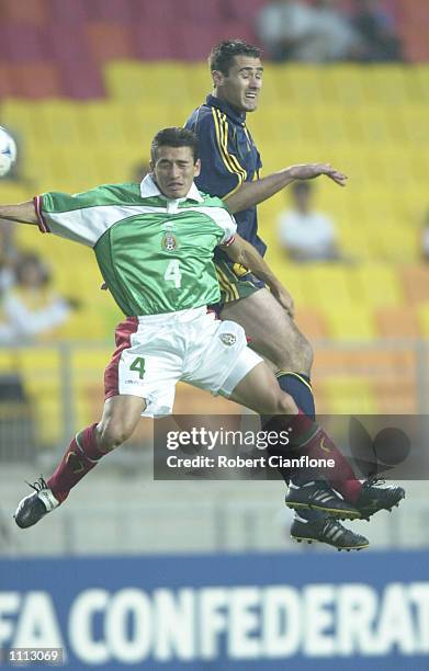 Clayton Zane of Australia challenges David Oteo of Mexico, during the 2001 FIFA Confederations Cup Group A match between Mexico and Australia at the...