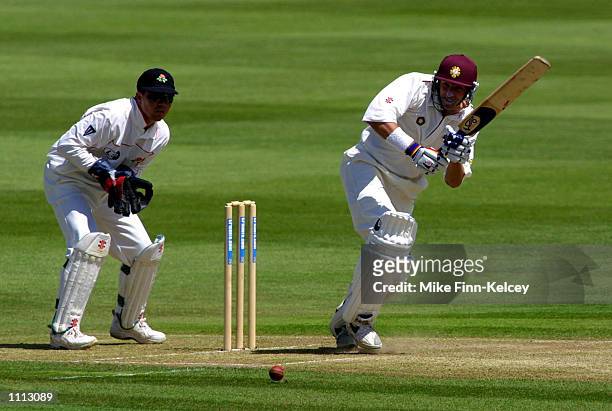 Michael Hussey of Northamptonshire hits out on his way to 70 against Lancashire on day one of the CricInfo County Championship match at Wantage Road,...