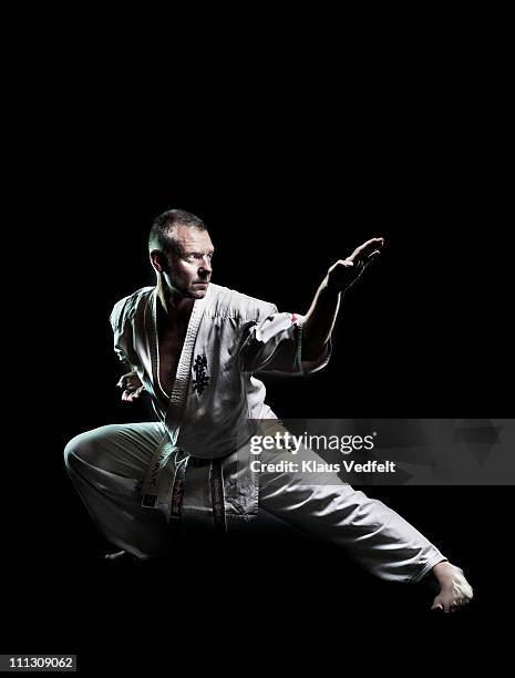 man in karate exercise - arte marziale foto e immagini stock