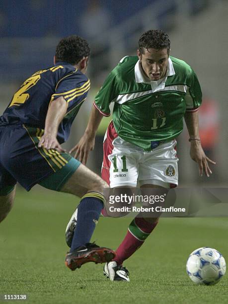 Daniel Osorno of Mexico looks to get past Kevin Muscat of Australia, during the 2001 FIFA Confederations Cup Group A match between Mexico and...
