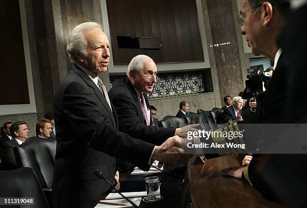 Chairman of the Joint Chiefs of Staff Admiral Mike Mullen greets Sen. Joseph Lieberman and committee chairman Sen. Carl Levin prior to a hearing...