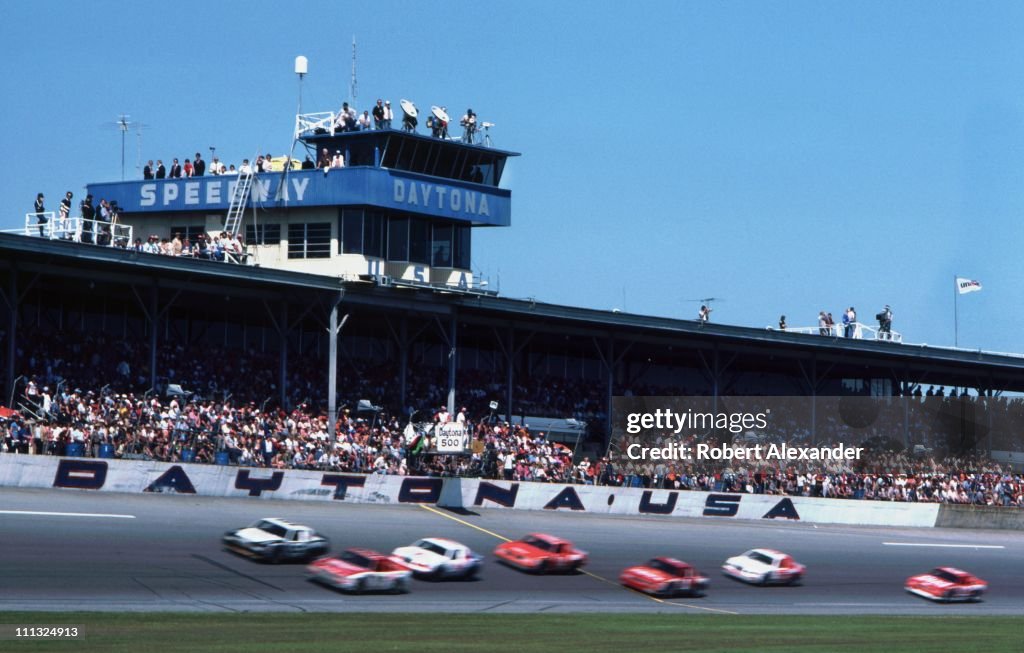 1983cart Racing Race cars competing in the 1983 Daytona 500 pass the grandstands at ...