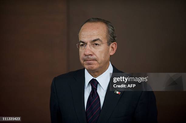 Mexican President Felipe Calderon and resigning Attorney General Arturo Chavez , offer a press conference to announce Chavez's resignation, at Los...