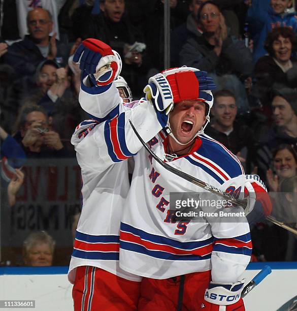 Vaclav Prospal of the New York Rangers celebrates his goal at 14:25 of the first period against the New York Islanders and is grabbed by Michael...