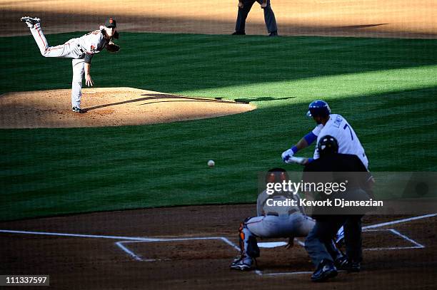 Tim Lincecum of the San Francisco Giants throws a pitch against James Loney of the Los Angeles Dodgers on Opening Day at Dodger Stadium on March 31,...