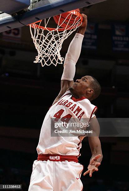 Chris Hines of the Alabama Crimson Tide attempts a dunk against the Wichita State Shockers during the 2011 NIT Championship game on March 31, 2011 at...