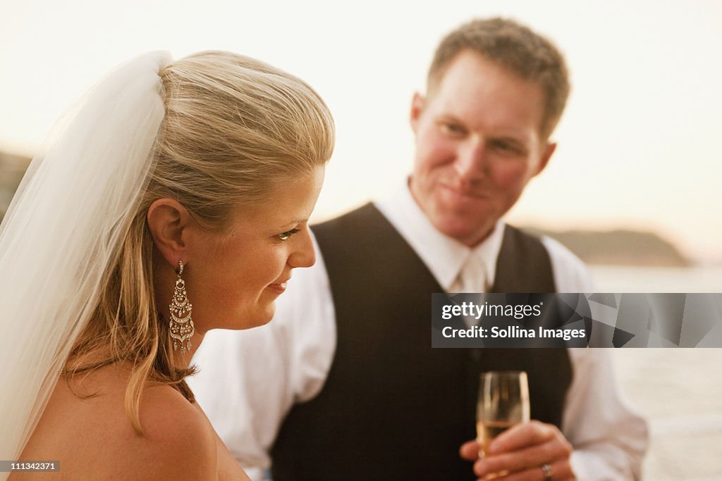 Newlyweds enjoy champaign on the bay