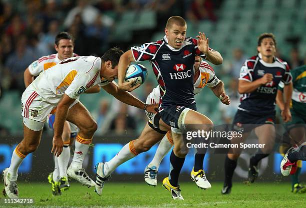 Drew Mitchell of the Waratahs makes a break during the round seven Super Rugby match between the Waratahs and the Chiefs at Sydney Football Stadium...