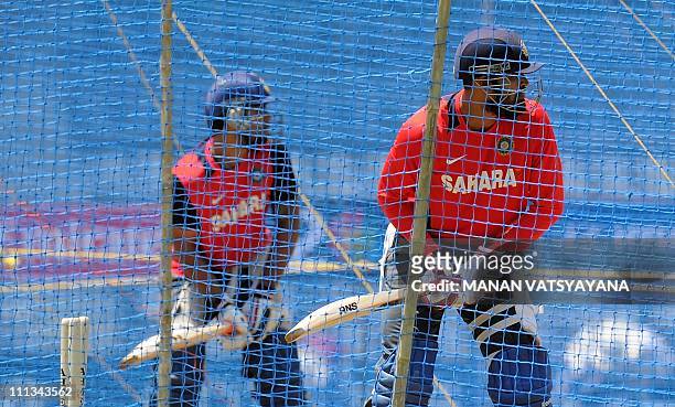Indian cricketers Yusuf Pathan and Virat Kohli bat in the nets during a training session at The Wankhede Stadium in Mumbai on April 1, 2011. India...