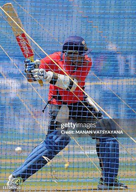 Indian cricketer Virender Sehwag bats in the nets during a training session at The Wankhede Stadium in Mumbai on April 1, 2011. India will play Sri...