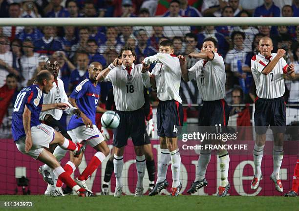 French captain Zinedine Zidane scores France's equaliser against England, 13 June 2004 during their opening match at the European Nations football...