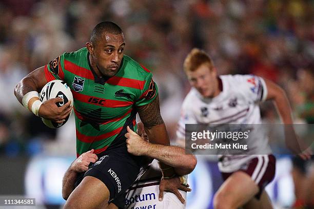Roy Asotasi of the Rabbitohs looks for support in a tackle during the round four NRL match between the South Sydney Rabbitohs and the Manly Warringah...