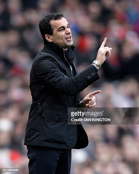 Wigan Athletic's Spanish manager Roberto Martinez gestures during the English Premier League football match between Arsenal and Wigan Athletic at The...