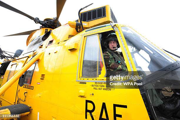 Prince William at the controls of a Sea King helicopter during a training exercise at Holyhead Mountain, having flown from RAF Valley on March 31,...