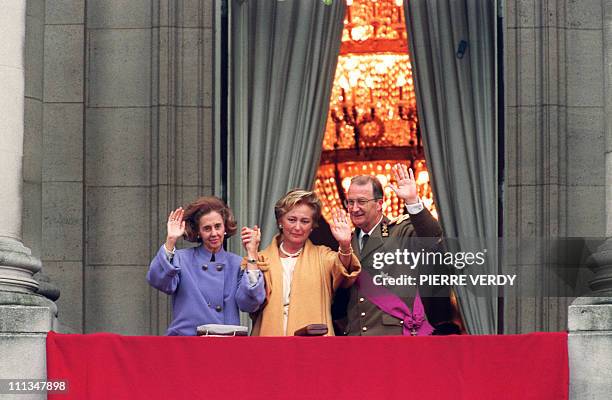 Belgian King Albert II with his wife Queen Paola and Queen Fabiola, widow of the late King Baudouin I, wave from a balcony of the royal palace 09...