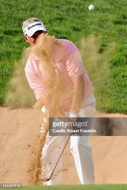 Darren Clarke of Northern Ireland plays a bunker shot during the second round of the Trophee du Hassan II Golf at the Golf du Palais Royal on April...