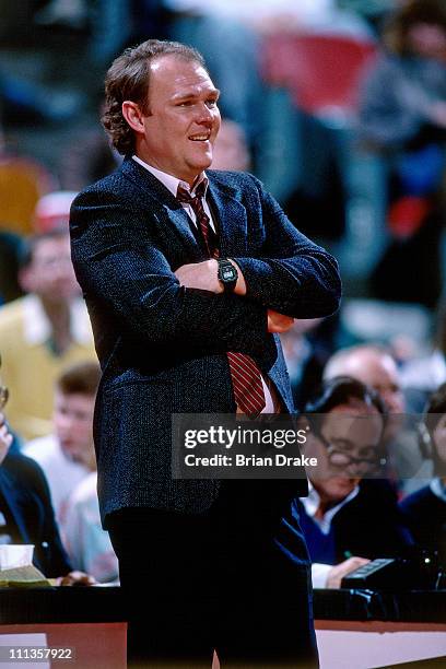 Golden State Warriors head coach George Karl smiles against the Portland Trailblazers at the Veterans Memorial Coliseum in Portland, Oregon circa...