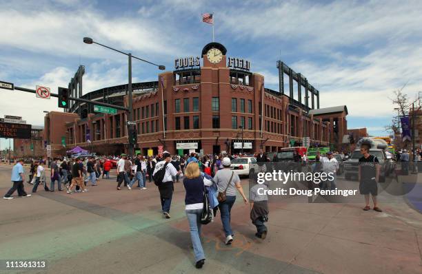 Fans make their way toward the stadium as the Colorado Rockies host the Arizona Diamondbacks during Opening Day at Coors Field on April 1, 2011 in...