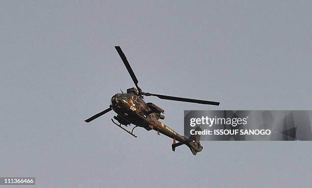 French military mission in Ivory Coast helicopter flies over Abidjan on April 1, 2011. Ivory Coast strongman Laurent Gbagbo's forces repulsed an...