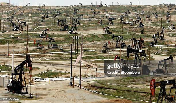 Oil pumps stand at the Chevron Corp. Kern River oil field in Bakersfield, California, U.S., on Tuesday, March 29, 2011. While most of the oil has...