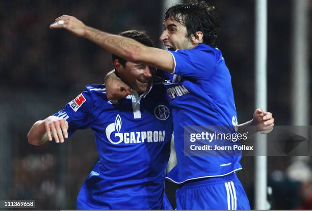 Julian Draxler of Schalke celebrates with his team mate Raul after scoring his team's second goal during the Bundesliga match between FC St. Pauli...