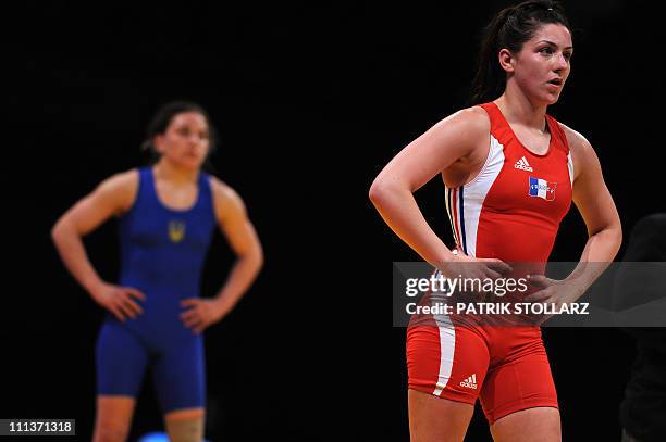 Adeline Vescan from France and Ganna Vasylenko from Ukraine react after the final for the third place of the European Wrestling Championship 59 kg...
