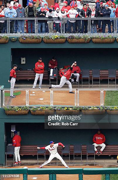 Starting pitchers Brett Myers of the Houston Astros and Roy Halladay of the Philadelphia Phillies warm up in the bullpen prior to the start of...