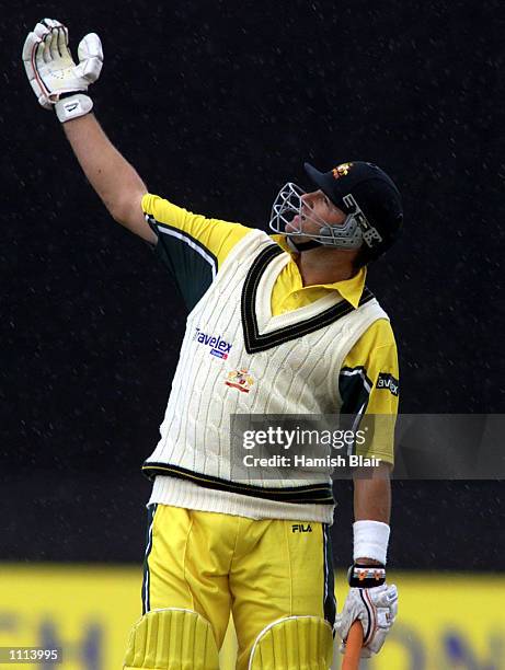 Mark Waugh of Australia studies the direction of the rain, during the one day tour match between Northamptonshire and Australia, played at the County...