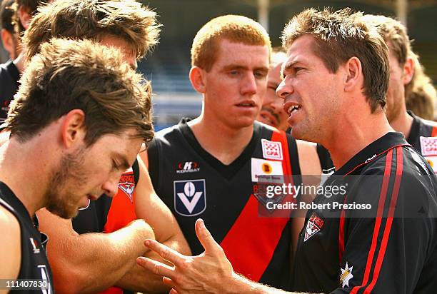 Shannon Grant coach of the Bombers talks to his players during the round one VFL match between the Northern Bullants and the Bendigo Bombers at Visy...