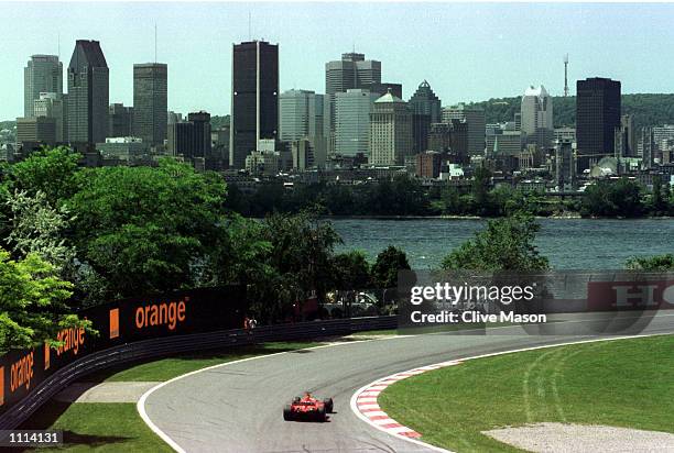 Rubens Barrichello of Brazil and Ferrari speeds around the picturesque Gilles Villeneuve circuit during first timed practice for the Formula One...