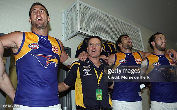 Dean Cox and John Worsfold of the Eagles join in the singing the club song to celebrate after winning the round two AFL match between Port Adelaide...