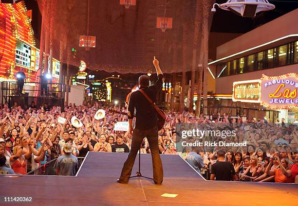 Musician Chris Young performs onstage during the Academy of Country Music concerts on Fremont at the Fremont Street Experience on April 1, 2011 in...