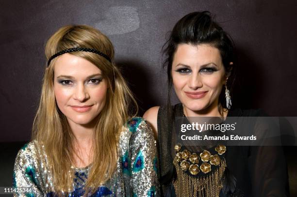 Musicians Leisha Hailey and Camila Grey of Uh Huh Her pose backstage before their performance at The El Rey Theatre on April 1, 2011 in Los Angeles,...