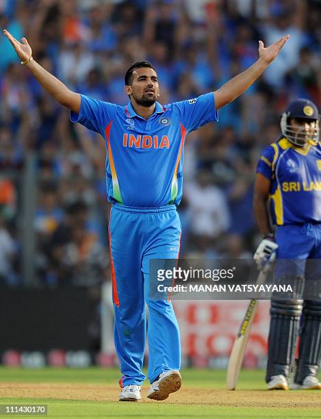 Indian fast bowler Zaheer Khan reacts after taking the wicket of Sri Lankan batsman Chamara Kapugedera during the ICC Cricket World Cup 2011 Final...